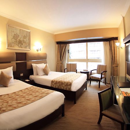 Pyramisa Suites Hotel Cairo Giza Екстериор снимка A room at the hotel